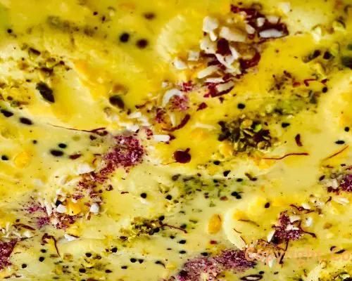 Rasmalai garnished with saffron and pistachio